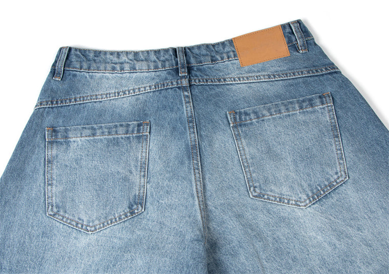 EAC–Distressed Curved Jeans